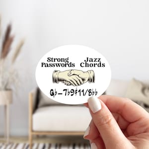 May include: White oval sticker with black text that reads "Strong Passwords" and "Jazz Chords" with a handshake graphic in between. Below the graphic is the text "Gb-7b9#11/8bb"