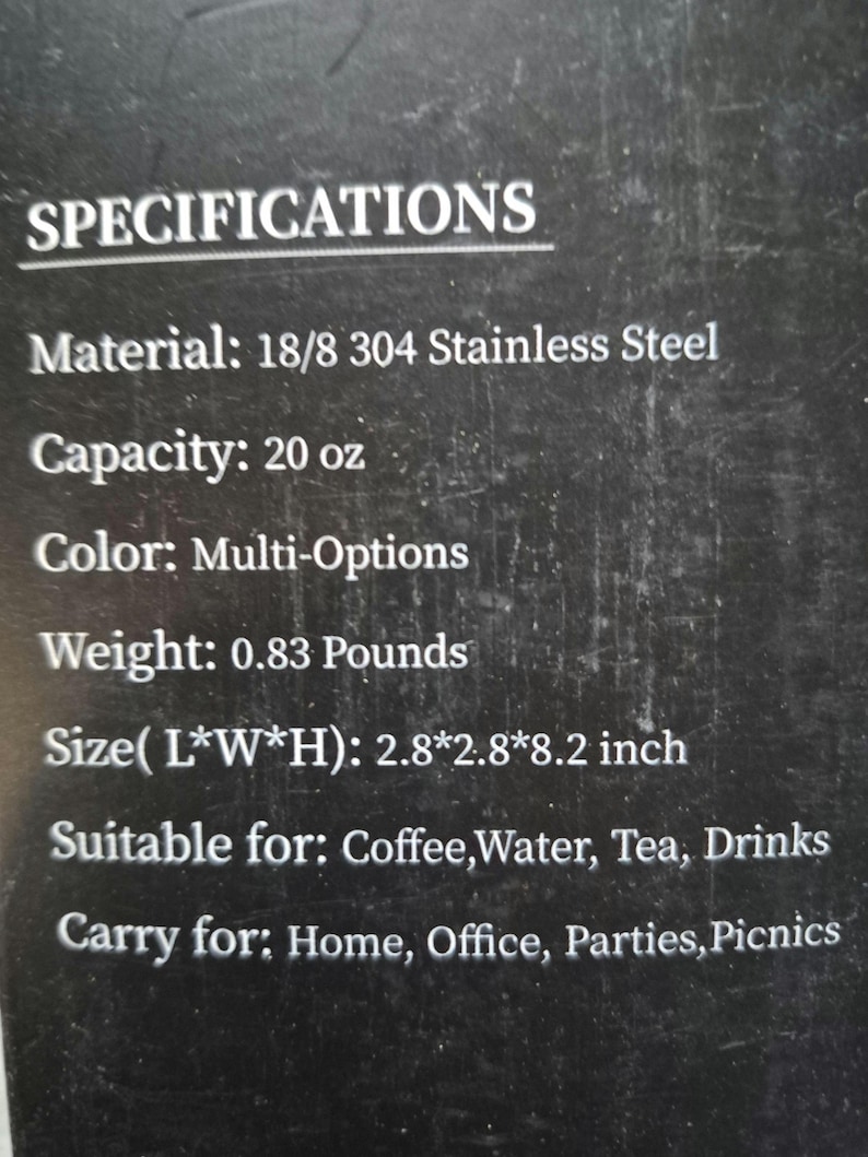 May include: Text on a black background provides specifications for a stainless steel product. The capacity is 20 oz, and the weight is 0.38 kg. The dimensions are 7.1x7.1x20.8 cm. Suitable for coffee, water, tea, and drinks.