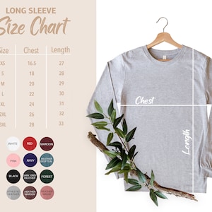 Puede incluir: Tabla de tallas para una camisa de manga larga con medidas en pulgadas para el pecho y la longitud. La tabla muestra las tallas XS a 3XL. La camisa se muestra en color gris claro.