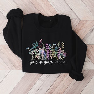 May include: Black sweatshirt with a floral design and the text "grow in grace 3 Peter 3:18"