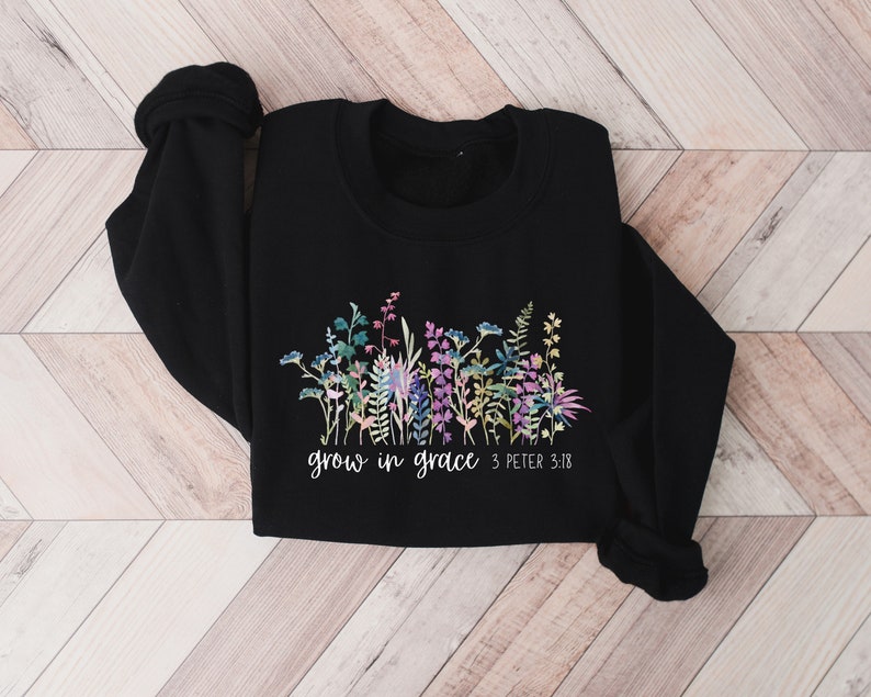 May include: Black sweatshirt with a floral design and the text "grow in grace 3 Peter 3:18"
