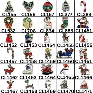 May include: A grid of 30 small metal Christmas-themed charms, each labeled with a code from CL155 to CL1471. The charms feature colorful enamel designs including Santa Claus, reindeer, snowmen, Christmas trees, stockings, bells, and candy canes.