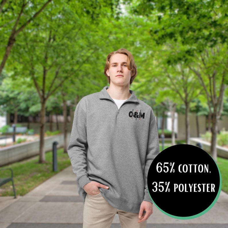 Model in fleece. 65% cotton, 35% polyester. Review: “Very nice quality and super cute, sharp graphic design. Love it!”