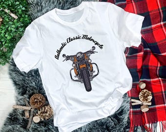 May include: White t-shirt with a black and white illustration of a classic motorcycle. The text "Authentic Classic Motorcycle" is printed on the shirt.
