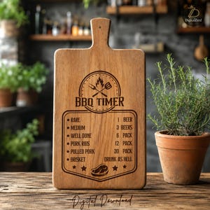 May include: A rectangular wooden chopping board with a handle and a hole for hanging. The surface features a laser-engraved BBQ timer chart with text including Rare, Medium, Well Done, Pork Ribs, Pulled Pork, Brisket, and beer-related quantities.