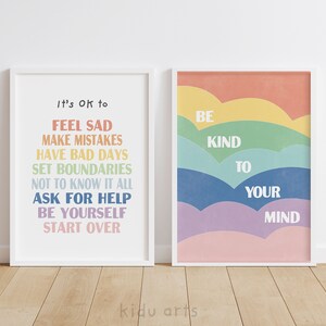 May include: Two framed prints with motivational messages. The first print has a rainbow color scheme and says "It's OK to feel sad, make mistakes, have bad days, set boundaries, not to know it all, ask for help, be yourself, start over". The second print has a rainbow color scheme and says "Be kind to your mind".