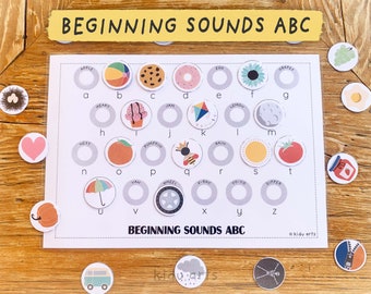 May include: A white printable worksheet with a grey background and colourful illustrations of objects. The worksheet is designed to help children learn the beginning sounds of the alphabet. The letters are printed in lowercase and the words are printed in uppercase. The worksheet is titled "Beginning Sounds ABC".