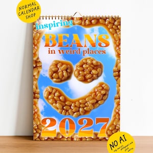 May include: A 2027 wall calendar featuring a border of baked beans and a central blue sky background. The text reads inspiring BEANS in weird places 2027. Baked beans are arranged to form a smiley face in the center of the calendar page.