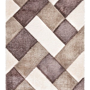 May include: A geometric patterned rug with a beige, brown, and white color scheme. The rug has a shaggy texture.