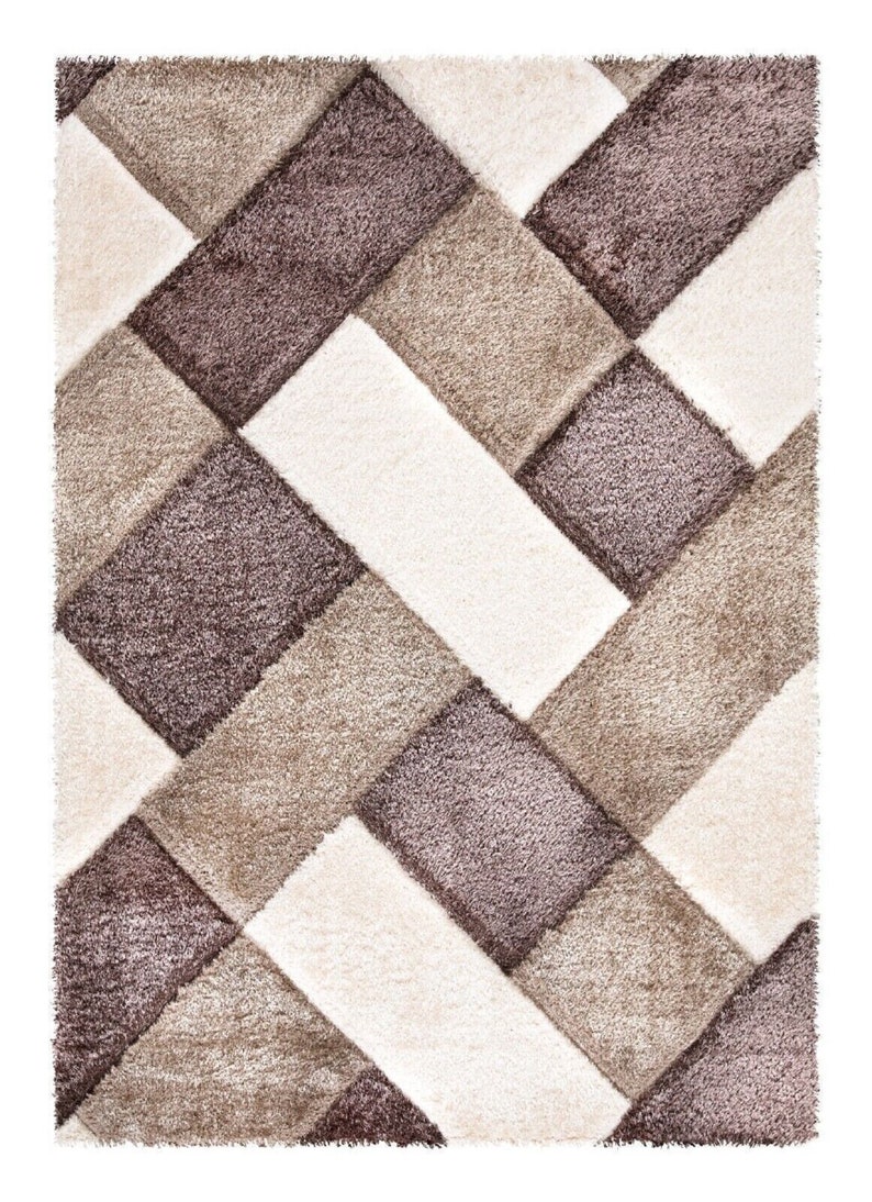 May include: A geometric patterned rug with a beige, brown, and white color scheme. The rug has a shaggy texture.