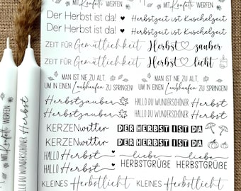 May include: A white sheet of paper with black text and illustrations. The text includes phrases like "Herbstzauber", "Herbstlicht", "Hallo Herbst", and "Zeit für Gemütlichkeit".