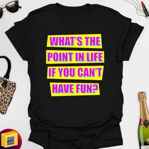 May include: Black t-shirt with a yellow and pink graphic that says "What's the point in life if you can't have fun?"