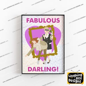 May include: A framed wall art print featuring the text FABULOUS DARLING! with a stylised illustration of two figures inside a gold picture frame against a purple heart and a light-coloured animal print background. One figure holds a glass bottle.