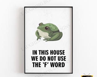 May include: A framed print featuring a cartoon frog in shades of green. The print has the text "IN THIS HOUSE WE DO NOT USE THE 'F' WORD" in bold black letters. The print is on a white background and has a black frame.