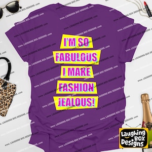 May include: A purple t-shirt with the text "I'M SO FABULOUS I MAKE FASHION JEALOUS!" in a colorful, bold font. The design is on a yellow rectangular background. The shirt is a casual wear item.