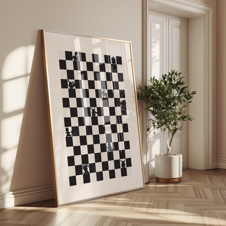 May include: Framed art print featuring a black and white checkerboard design with whimsical animal silhouettes in place of chess pieces. The artwork is displayed in a gold-toned frame, leaning against a wall in a well-lit room.