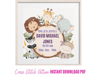 May include: A framed cross-stitch pattern featuring a jungle theme with a lion, giraffe, elephant, zebra, and hippo surrounding a wooden plaque. The plaque displays the name "DAVID MICHAEL JONES", date, time, weight, and length. The text "Cross Stitch Pattern INSTANT DOWNLOAD PDF" is at the bottom.