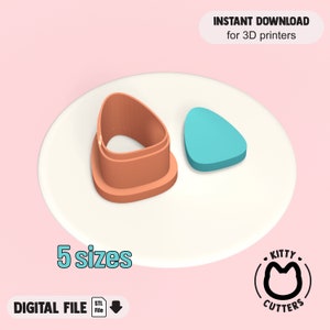 May include: A 3D printable cookie cutter in the shape of a triangle. The cutter is orange and comes in five sizes. The image also shows a blue triangle cookie cut out.