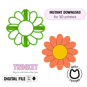 May include: Two daisy-shaped designs, one green and one orange, for 3D printing. The green daisy has a white center and the orange one has a yellow center. Text includes "INSTANT DOWNLOAD for 3D printers", "TRINKET", and "DIGITAL FILE".