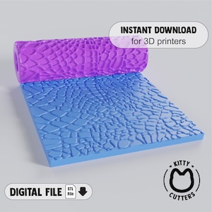 May include: A purple 3D printed rolling pin with a textured surface resembling a reptile skin pattern. The rolling pin is laying on a blue 3D printed textured surface. The text "INSTANT DOWNLOAD for 3D printers" is in a white box with a black outline. The text "DIGITAL FILE STL File" is in a white box with a black outline. The text "KITTY CUTTERS" is in a black circle with a white outline and a black cat silhouette inside.