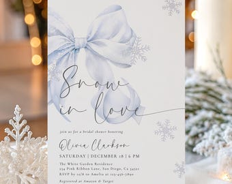 May include: A bridal shower invitation with a watercolor design. The invitation features a light blue bow and snowflakes, with the words "Snow in Love" in elegant script. Details include the date, time, and location.