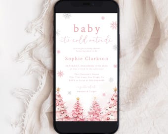 May include: A digital invitation for a baby shower with a pink and white winter theme. The invitation reads "baby it's cold outside" and features pink and white Christmas trees with snowflakes. The text also includes the name "Sophie Clarkson" and the date "Saturday, December 15th 20XX".