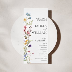 Peut inclure: Programme de c&eacute;r&eacute;monie de mariage avec un motif floral compos&eacute; de fleurs roses, bleues et jaunes. Le programme liste l'ordre des &eacute;v&eacute;nements, y compris le pr&eacute;lude, la mise en place des familles, le cort&egrave;ge d'entr&eacute;e, les mots d'ouverture, la lecture, l'&eacute;change des v&oelig;ux, l'&eacute;change des alliances, la pri&egrave;re, la pr&eacute;sentation du couple et la sortie.
