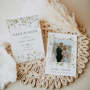 May include: Save the date card with a floral design and a photo of a couple. The card says "Save the Date for the wedding ceremony of Avery + Oliver, Sept 14, 2018, San Diego, CA".