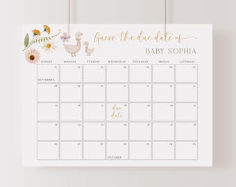 May include: A white calendar with the text "Guess the due date of BABY SOPHIA." The calendar has a floral design and illustrations of ducks. The date "due date" is highlighted on the 17th of the month.