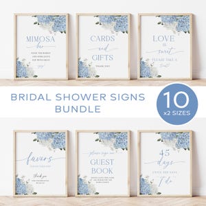 May include: A collection of framed bridal shower signs with floral accents. The signs include phrases like "Mimosa Bar," "Cards and Gifts," and "Love is Sweet." The bundle includes 10 signs in 2 sizes.