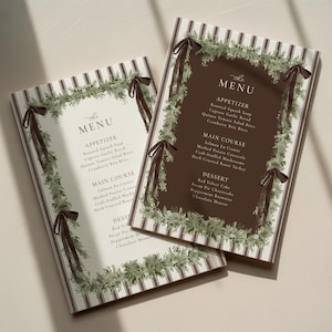 Puede incluir: Dos tarjetas de menú con un fondo a rayas y un borde decorativo de vegetación y cintas marrones. El texto del menú incluye aperitivos, platos principales y postres. El menú se titula "the MENU".