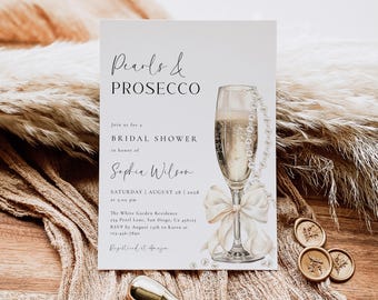 May include: A white bridal shower invitation with a watercolor illustration of a champagne flute with a pearl necklace and a white bow. The text reads "Pearls & Prosecco" and "Join us for a Bridal Shower in honor of Sophia Wilson".