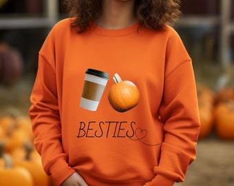 May include: Orange sweatshirt with a coffee cup and a pumpkin graphic and the text "BESTIES" with a heart.