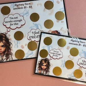 May include: Two scratch-off cards with a coffee theme. One card reads "Mystery Save amounts $1-$8" and the other reads "Mystery Save amounts $1-$5". Each card features a cartoon woman with a coffee cup and the phrase "I'm not awake enough for this."