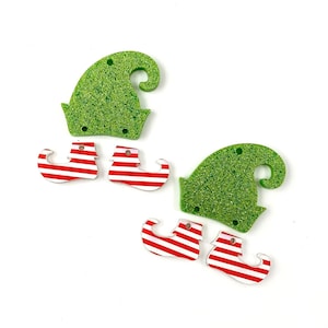 May include: Set of five Christmas elf ornaments. Two green glitter elf hats and three red and white striped elf shoes.
