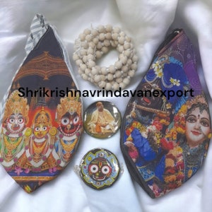 May include: A set of four colorful fabric pouches with images of Hindu deities, a wooden bead necklace, and three round decorative items with images of Hindu deities. The pouches are black with white stripes, blue with white flowers, and two with images of Hindu deities. The round decorative items are black with gold accents and images of Hindu deities. The text "Shrikrishna Vrindavan Export" is visible on the image.
