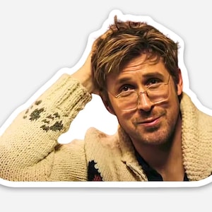 May include: A sticker featuring a person wearing glasses and a cream-colored sweater with a shawl collar. The sweater has a patterned design on the sleeve. The person is smiling and has their hand on their head.