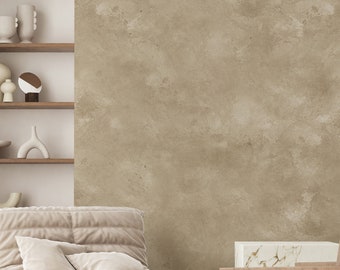 May include: A cozy living room scene with a beige tufted chair, two small wooden tables, and a wooden chair with a woven seat. A built-in shelf displays various ceramic vases. The room has a neutral color palette with a textured wall and a white rug.