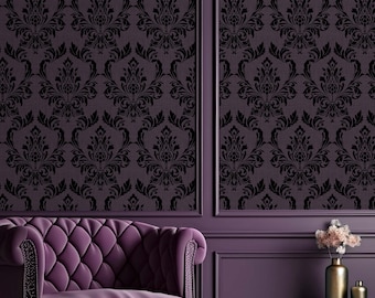 May include: A deep purple tufted armchair with rolled arms and nailhead trim sits beside a small round table holding a metallic vase. The wall features dark purple damask wallpaper panels framed by matching purple molding and trim.