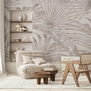 Large-scale palm leaf design in muted neutrals for a living room accent wall.
