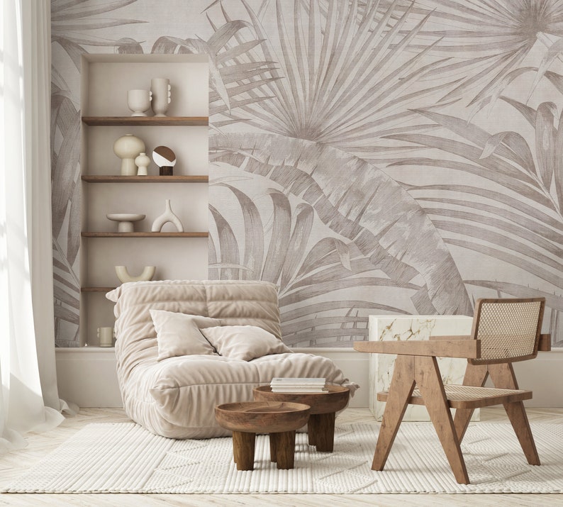 Large-scale palm leaf design in muted neutrals for a living room accent wall.
