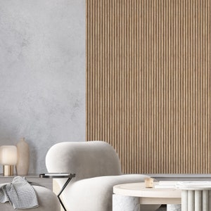 Könnte beinhalten: Ein weißer, plüschiger Sessel mit einem schwarzen Beistelltisch und einem weißen Couchtisch mit Marmorsockel. Der Sessel steht vor einer Wand mit vertikalen Holzpaneelen.