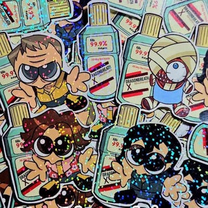 May include: A collection of colourful stickers featuring cartoon characters holding bottles of mouthwash. The mouthwash bottles have the text "Dragonbreath" and "Kills 99.9% of all germs" on them. The stickers are decorated with glitter.