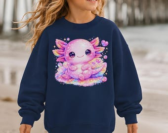 May include: A navy blue long-sleeve sweatshirt featuring a graphic print of a pink axolotl surrounded by colorful bubbles, stars, and small hearts. The sweatshirt has a crew neckline and ribbed cuffs, with the word NAVY printed in a box.