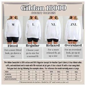 May include: Size chart for Gildan 18000 crewneck sweatshirts. The chart shows the measurements in inches for each size: S, M, L, XL, 2XL, 3XL, 4XL, and 5XL. The chart also includes the width, length, and sleeve length for each size. The model is 5'8" and wears a size 10.