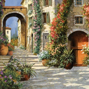 May include: An oil painting depicts a sunlit European street scene. Stone buildings with arched doorways and windows are adorned with climbing flowers. Terra cotta pots overflow with greenery and blooms, and a stone archway leads to a distant view.