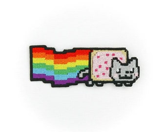 May include: Embroidered patch featuring a pixelated cat with a rainbow tail, holding a pink and white toast. The cat is wearing a pink and white toast costume.