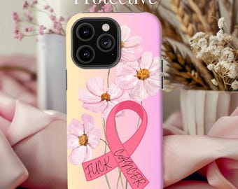 May include: Pink phone case with a pink ribbon and flowers. The ribbon has the text "FUCK CANCER" on it.