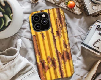 May include: A yellow and brown iPhone case with a corrugated metal design. The case has a weathered, rusty appearance with vertical lines and a textured surface. The case has a camera cutout with three lenses.
