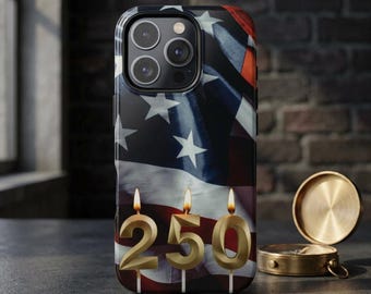 May include: A smartphone case featuring a printed design of the American flag with three gold-colored number candles shaped as 250, each topped with a lit flame. The case has a cutout for a triple-lens camera system on the upper left side.